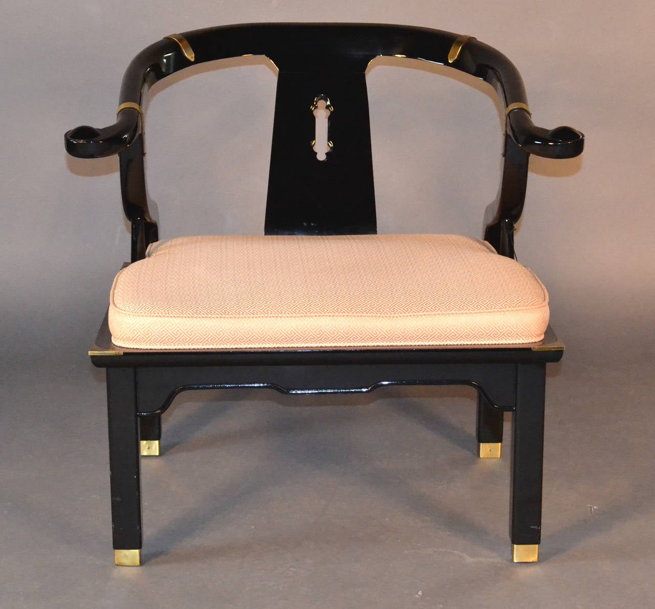 Single black lacquer and linen upholstered attached cushion seat, yoke back chair with tapered legs, brass sabots and brass banding.