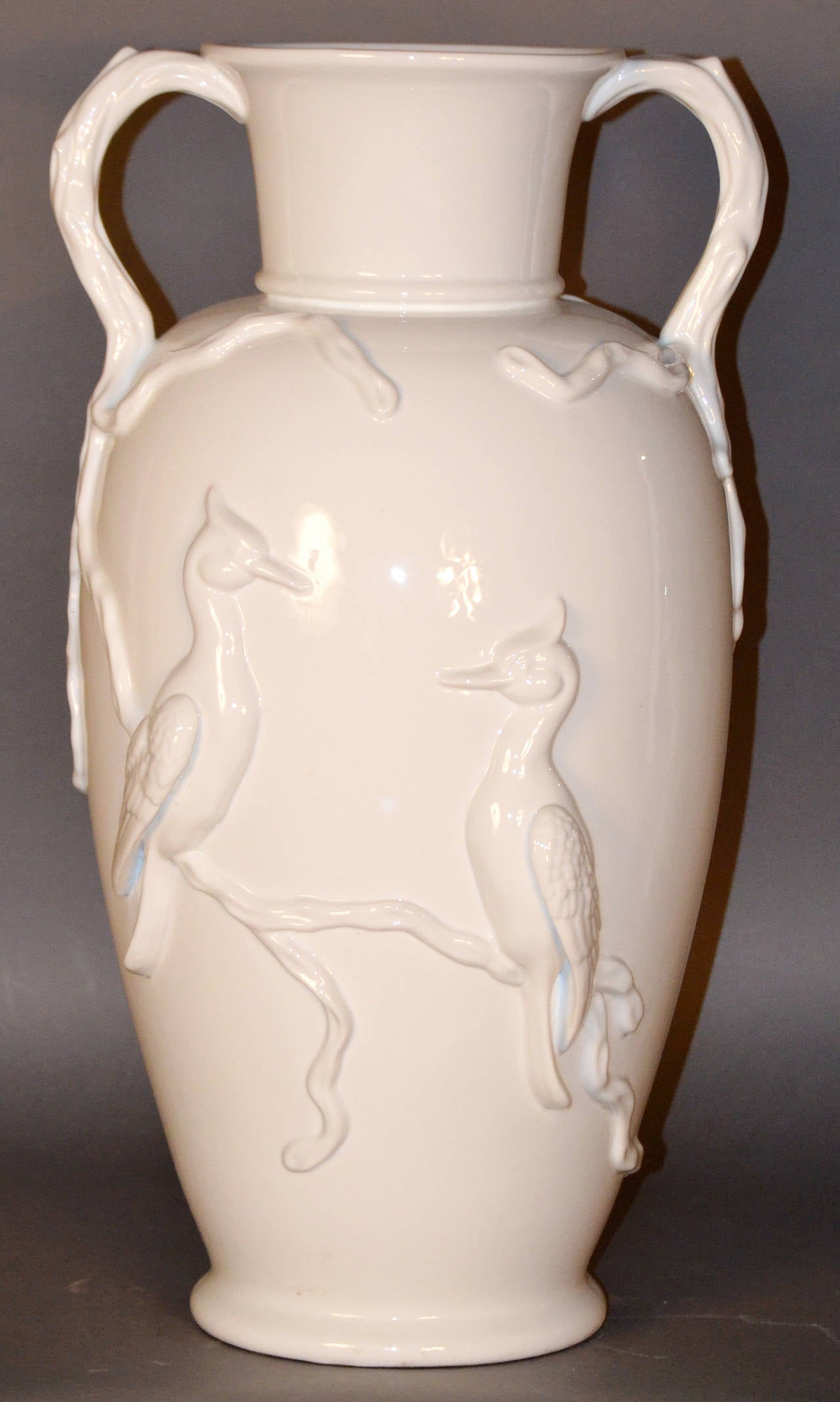 Monumental Elgin Paris blanc de chine handled vase with relief in Asian birds and branches.