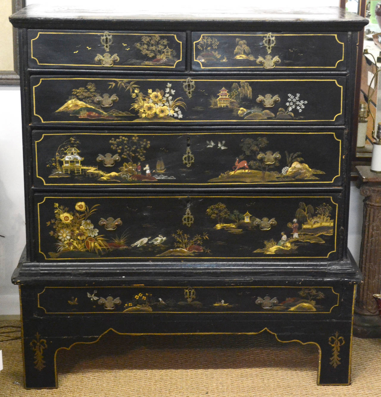Beautiful chinoiserie detail. Two top drawers over three large dresser drawers.