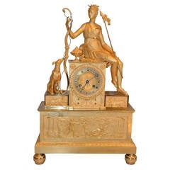 French Empire Gilt Mantel Clock Featuring a Seated Diana, Goddess of the Hunt