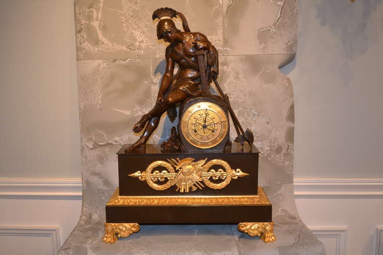 Restauration Period Patinated and Gilt Mantle Clock Featuring Wounded Soldier