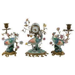 Chantilly porcelain clock and candelabra garniture