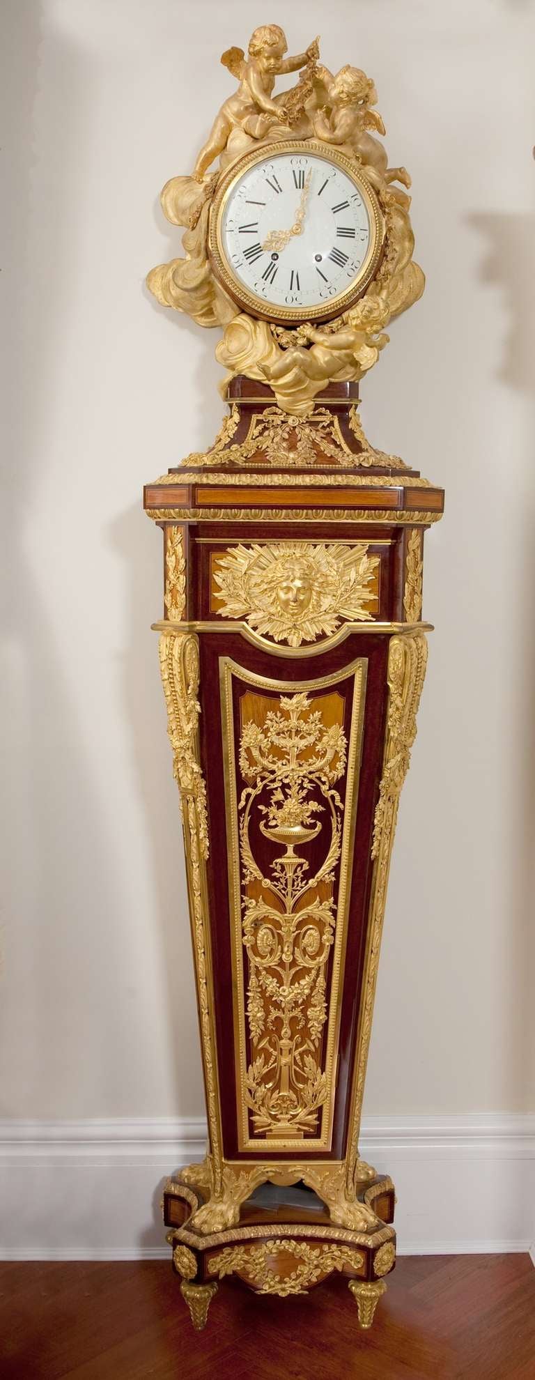 The 'regulateur de parquet' is a copy of the model attributed to Jean-Henri Riesener (received Master in 1785), and now in the permanent collection of the Musee de Louvre.  This was one of the 18th century models admired by the finest cabinetmakers