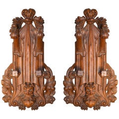 Pair of walnut wall decorations, possibly gun racks