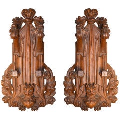 Pair of walnut wall decorations, possibly gun racks