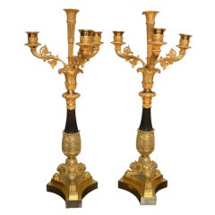 Pair of French Restauration period gilded and patinated bronze candelabra