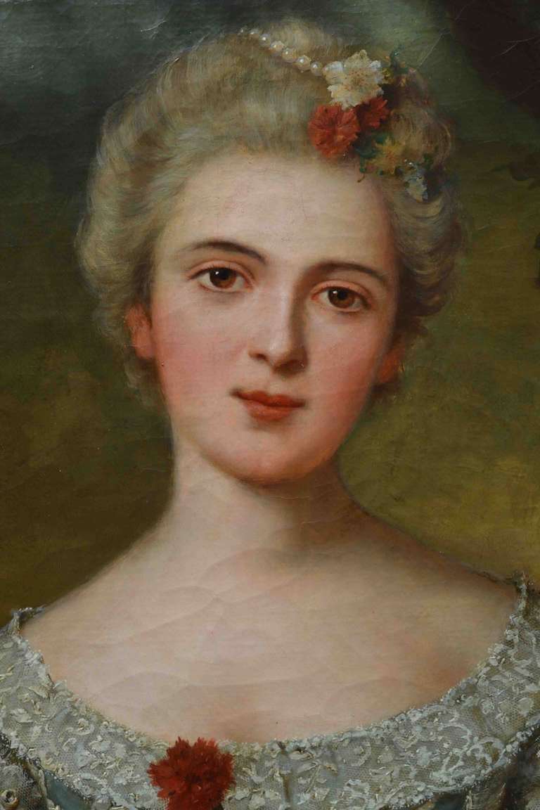 A large very well executed three quarter length oval portrait of possibly Princess Louise, one of the daughters of Louis XVI (after Natier) standing in a landscape; the beautiful young lady holds a flower in one hand and a bouquet in the other;