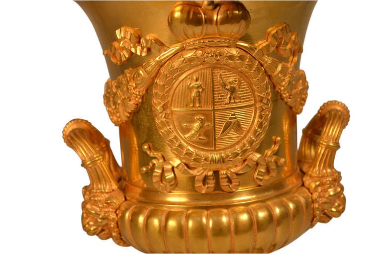 Antique gilt bronze campana shaped vase with heraldic decoration, and lion's heads mask handles; English/American 19thC;

Dimensions; 12