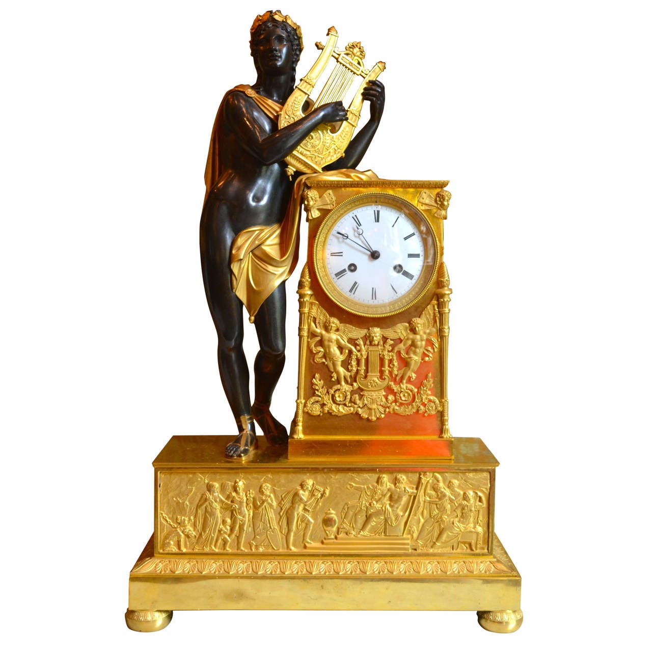 Period Empire Clock Featuring a Standing Apollo, God of Music For Sale