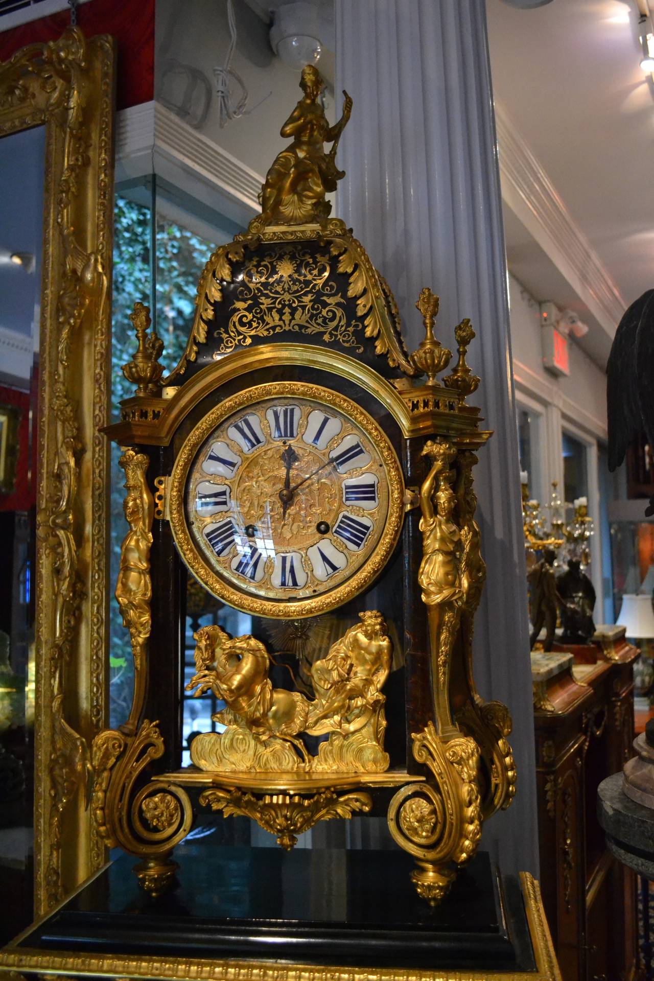 An exceptional piece of 19thC Boulle work cabinetry and 18thC horlogy reportedly from the estate of Randolf Hearst.  The plinth and clock case with brass inlay and richly decorated with gilded bronze.  The bracket clock has been re-fitted with an