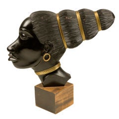 Carved and ebonized African female head