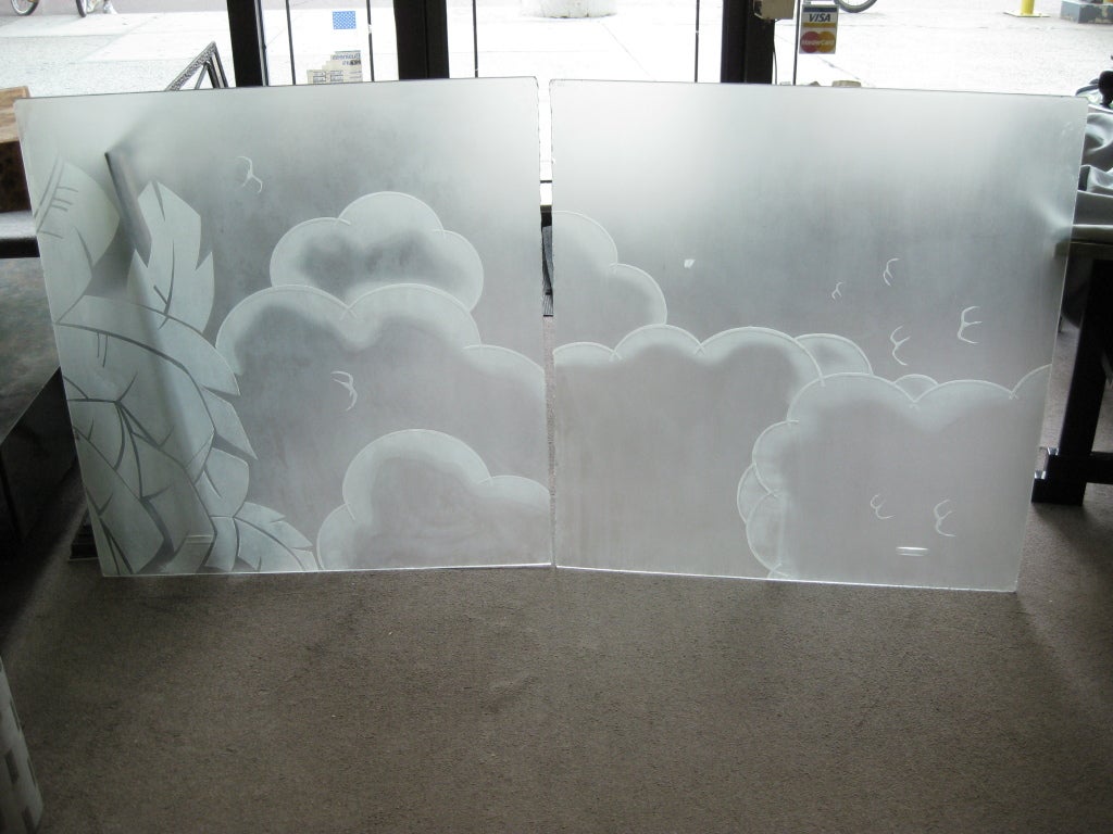 Two acid etched frosted glass architectural panels from the Art Deco period. The cloud and bird motif drift across the scene while the highly stylized foliate motif on the border serves as an anchor to this pictorial canvas.
You can frame these out