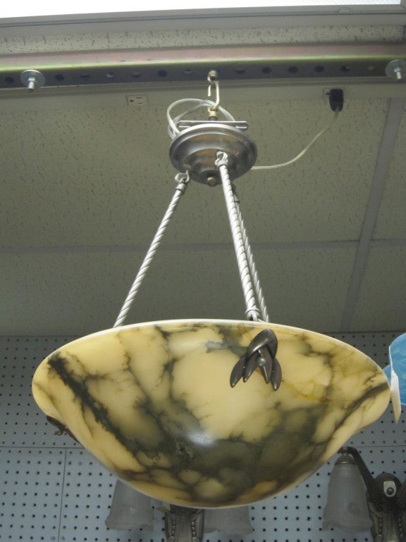 This original French Art Deco alabaster chandelier with flared rim is grey veined with highly contrasting background color and exciting patterns caused by the natural veins of the stone.
 Mounted on a nickeled bronze rope twist armature.
Holds