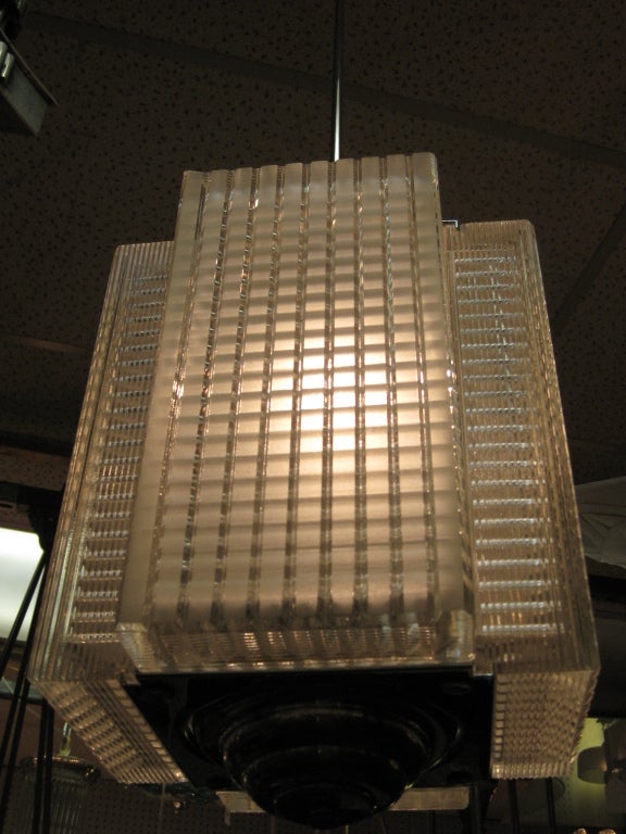 Pair of rectangular corrugated cubist patterned drop chandeliers In Excellent Condition In New York City, NY