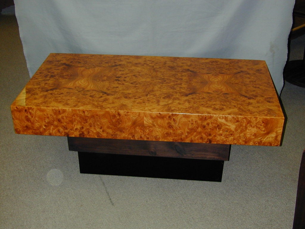 French Art Deco rectangular shaped burl wood coffee table raised on ebonized stepped cubist base. The wide apron with matching burl veneer. The top book matched with exotic design.
Key:living room suites,low boy,end table,antique, Italian