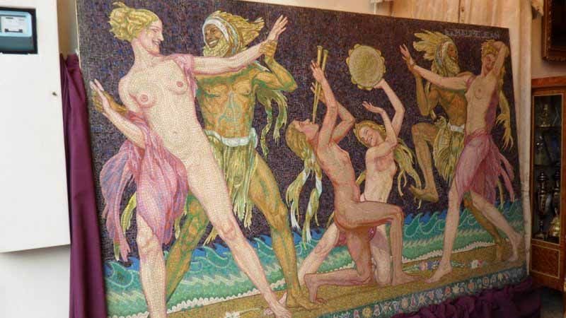 This rare and palatial mosaic was displayed at the entrance to the Maumejean Pavilion at the 1925 Exposition Internationale Des Arts Decoratifs et Industriels Modernes. It measures 120 inches long by 78 inches high (3.00 m x 1.95 m). It depicts four