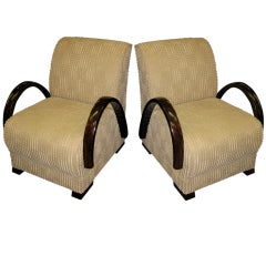Pair of French Art Deco curved arm upholstered club chairs