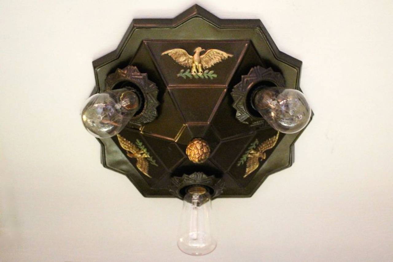 Circa 1930. Art Deco flush mount fixture featuring a prominent American Eagle, fitted with three Edison (tungsten) bulbs. Cleaned, rewired, restored, and ready to hang. 

Measurements: 6