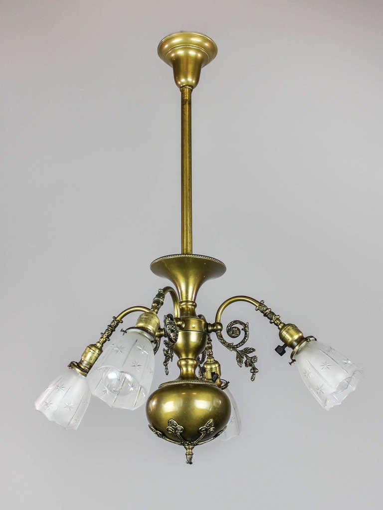 Ca. 1910 A Colonial Revival style light fixture by R. WIlliamson & Co. of Chicago, Illinois. Decorated, scrolling arms with original shades and antique finish. Re-wired and ready to mount.  35″L x 25″W