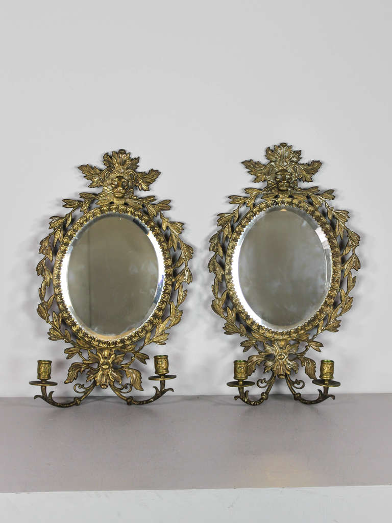 C.19th Century pair of cast figural brass wall mounted mirrors with candleholder. Beautifully cast, with original mirror and lion motif. Matched pair. (Sold only as a pair)
Measurements: 19.5″H X 12″W X 4.5″D
SKU: WS1045