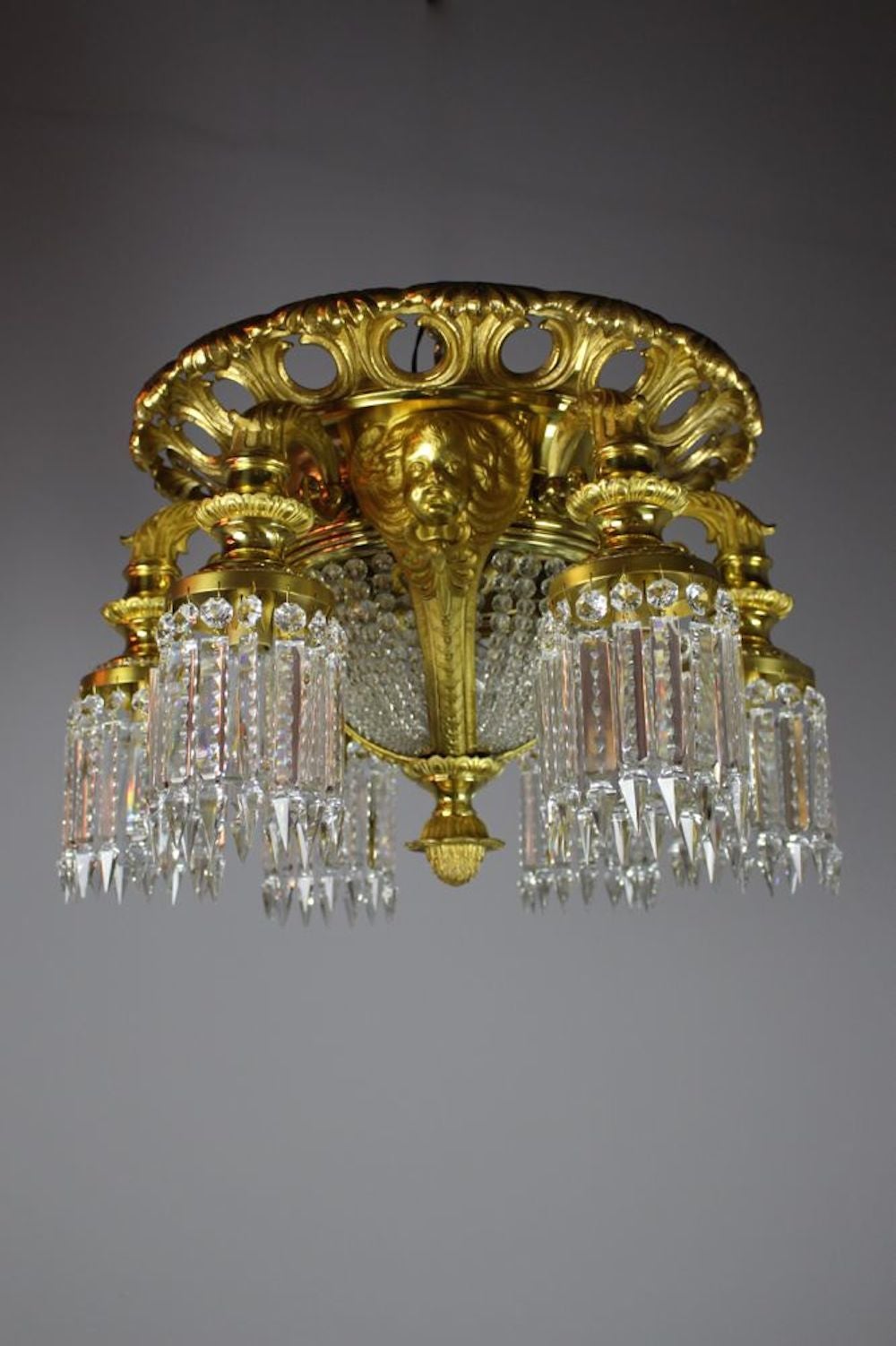 Early 20th Century Notched Crystal Commercial Lobby Flush Mount with Cherubs, Ten-Light For Sale