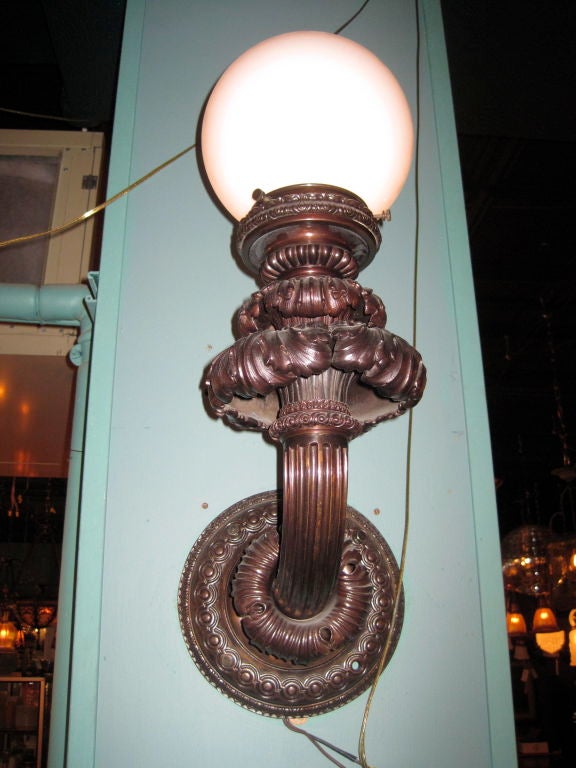 Ca. 1910 Pair of highest quality cast bronze exterior sconces, manufactured by 'Caldwell' of New York. Originally from a luxury hotel in Florida.
Measurements: 24