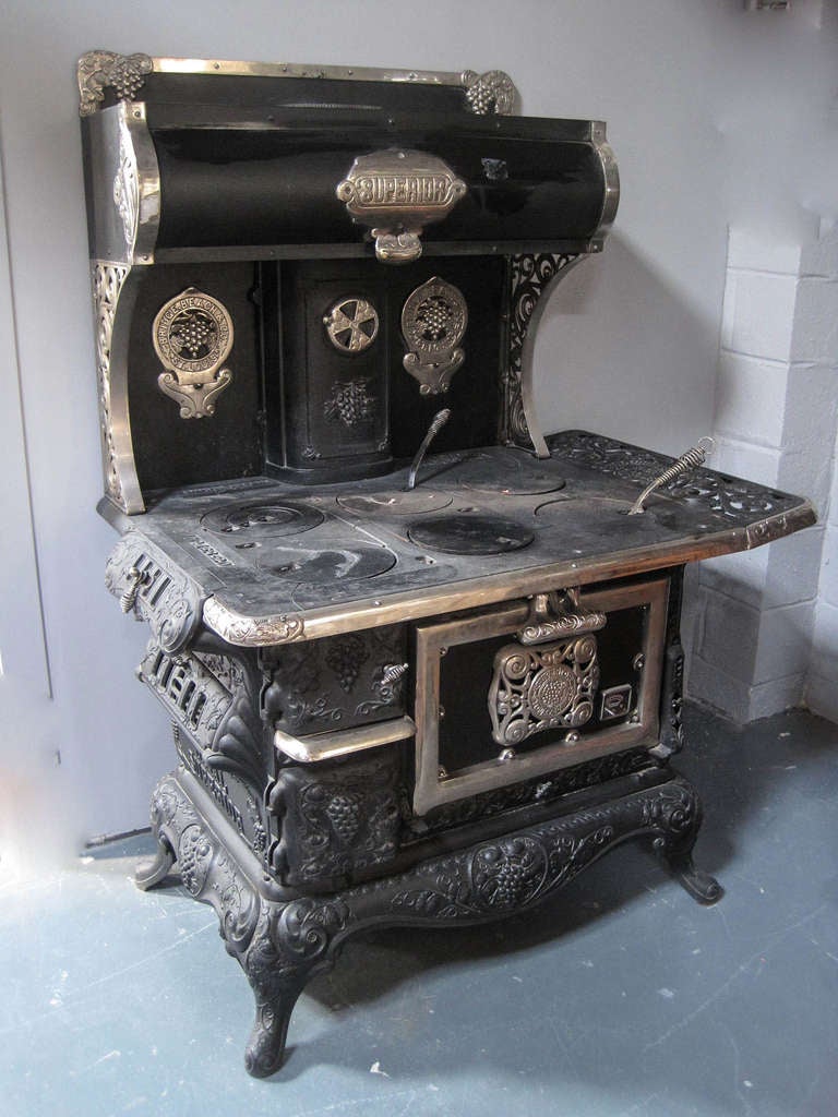 Cast iron wood burning Victorian-style stove with all original parts. Oven re-lined