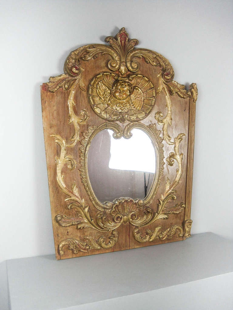 Ca.19th Century Carousel panel, American. With winged cherub in center and decorated with gilt wood moldings. Center has mirror insert.
Measurements: 45.5
