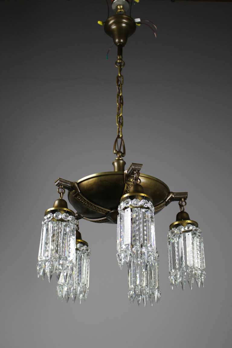 Circa 1910. This Colonial Revival fixture is attributed to Edward Miller & Co. Restored to its original finish and fitted with notched crystal, this lovely crystal chandelier is perfect for a dining room and is rewired and ready to
