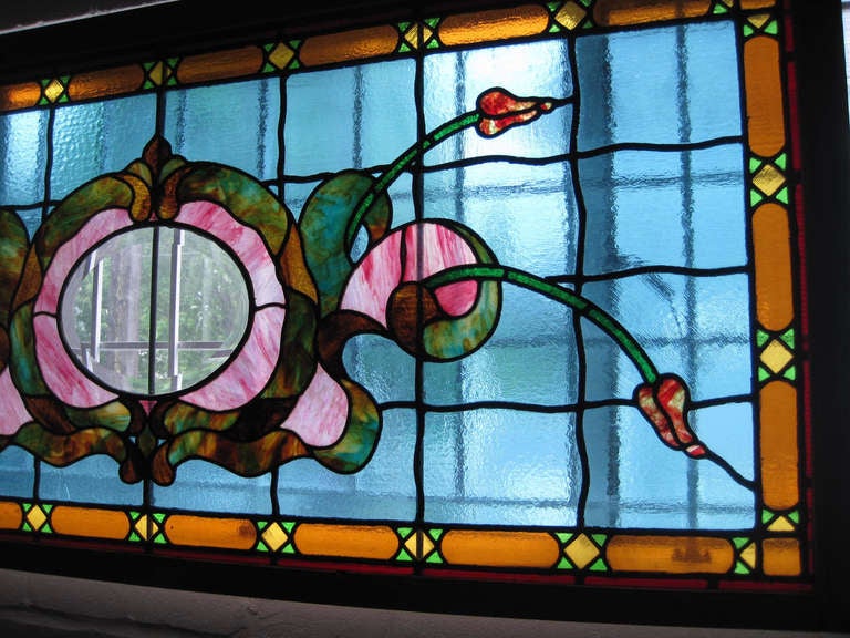 Ca. 1919 Large and vibrant stained glass window with quintessential Victorian colors. A very detailed piece of glass, found in Ottawa, ON.
Measurements: 74