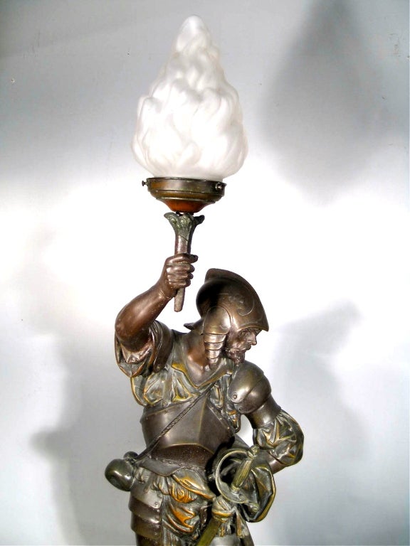 Mitchell Vance & Co. Warrior Newel Post Lamp.Converted from gas to electric with flame shade, body made of bronze spelter.