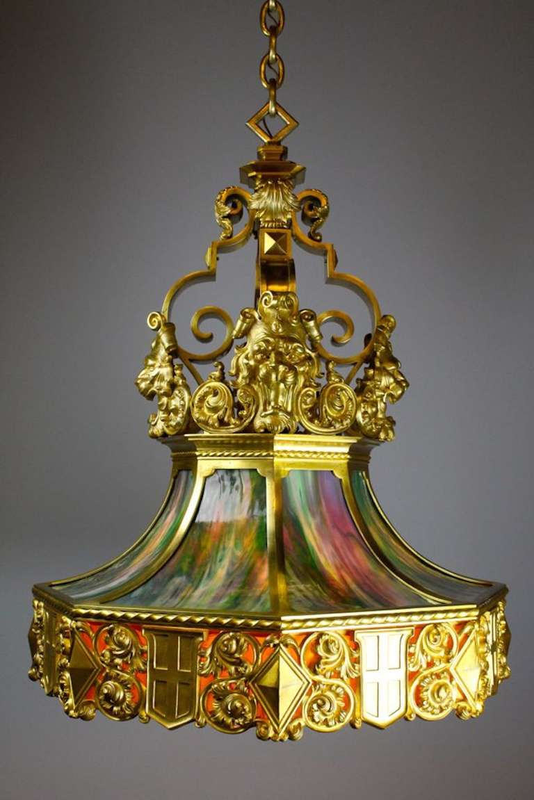 This is an exceptional bronze lantern attributed to E. F. Caldwell. Found in New York City, this Renaissance revival chandelier remains totally untouched with an original finish as good as it gets. Retaining all of its original slumped glass panels