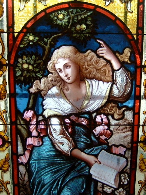 A stunning pair of classical painted stained glass windows of the highest quality, featuring romantic maidens or 'muses' of literature and music. Each window has 20 hand cut faceted jewels and features the finest hand painted and fired inserts.