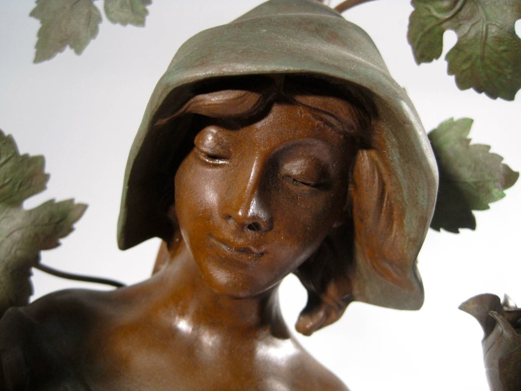 Ca. 1910 French figural newel post style lamp, made of spelter and fully restored. Marked 'Botteleuse, par Rousseau' with the Paris, France foundry seal on the back. This figure wears a green hooded cloak and carries a sheaf of wheat.
Measurements: