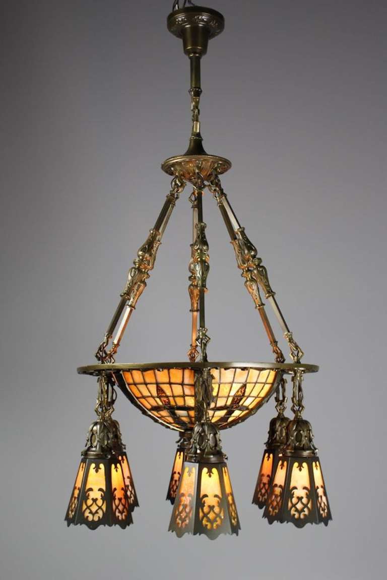 Circa 1910. This super high quality leaded glass bowl fixture was found in New york City and wears it original finished. Fitted with a set of hand sewn period shades. Bowl features a gothic cross motif.

 SKU: DF1166 Measurements: 42"H x