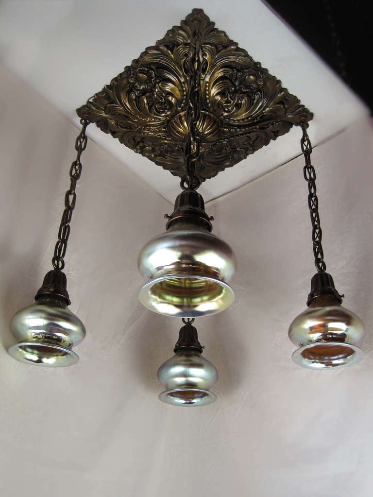 Ca. 1915 Deeply embossed 4-light flush mount fixture with a unique 