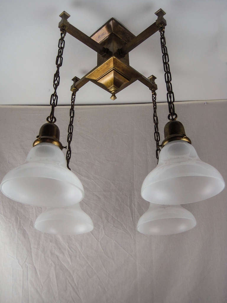 Ca. 1914 Mission style Arts & Crafts flush mount light fixture with four arms. Traditional straight-forward mission design, restored and fitted with period-correct etched shades.
Measurements: 24