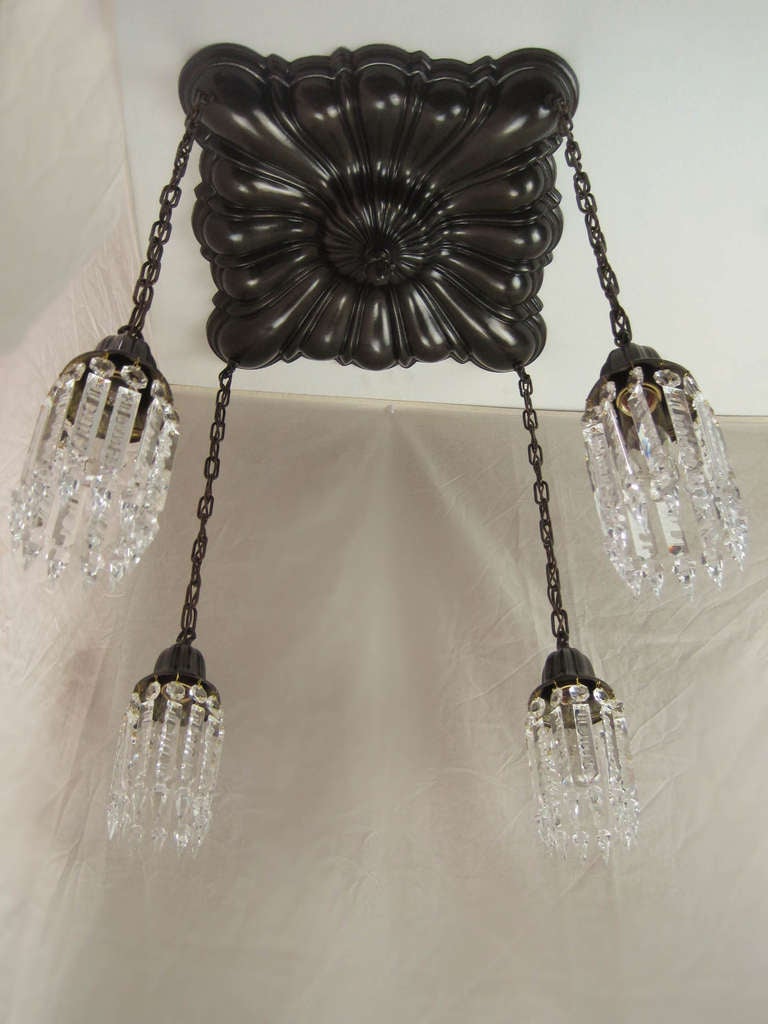 Ca. 1912 Large Sheffield flush mount fixture fitted with notched crystal. Beautiful all original fixture with matching bells.
Measurements: 29.5"L x 18"Sq. SKU: FF1012