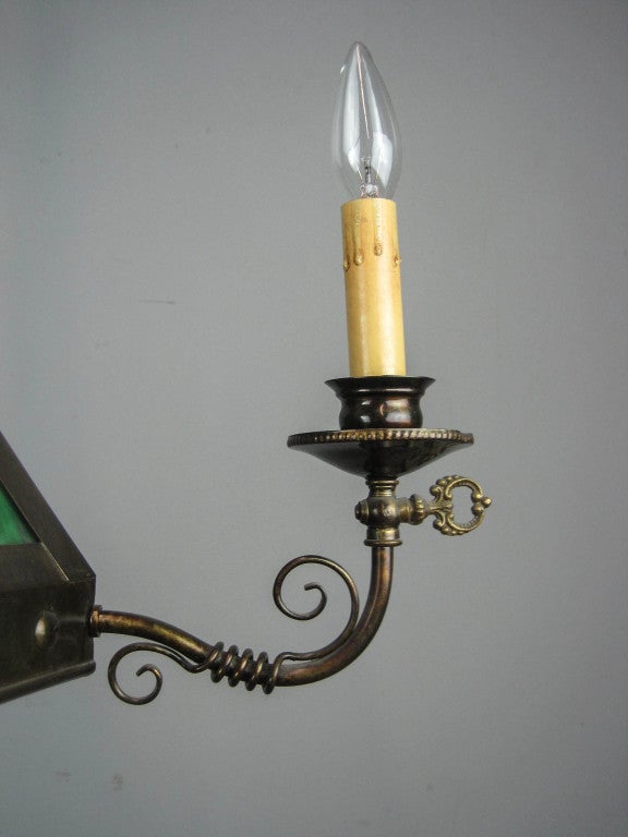 All original three-light refinished in an antique bronze with original green slag glass, circa 1905. Sourced in New York City.
Measurements: 39