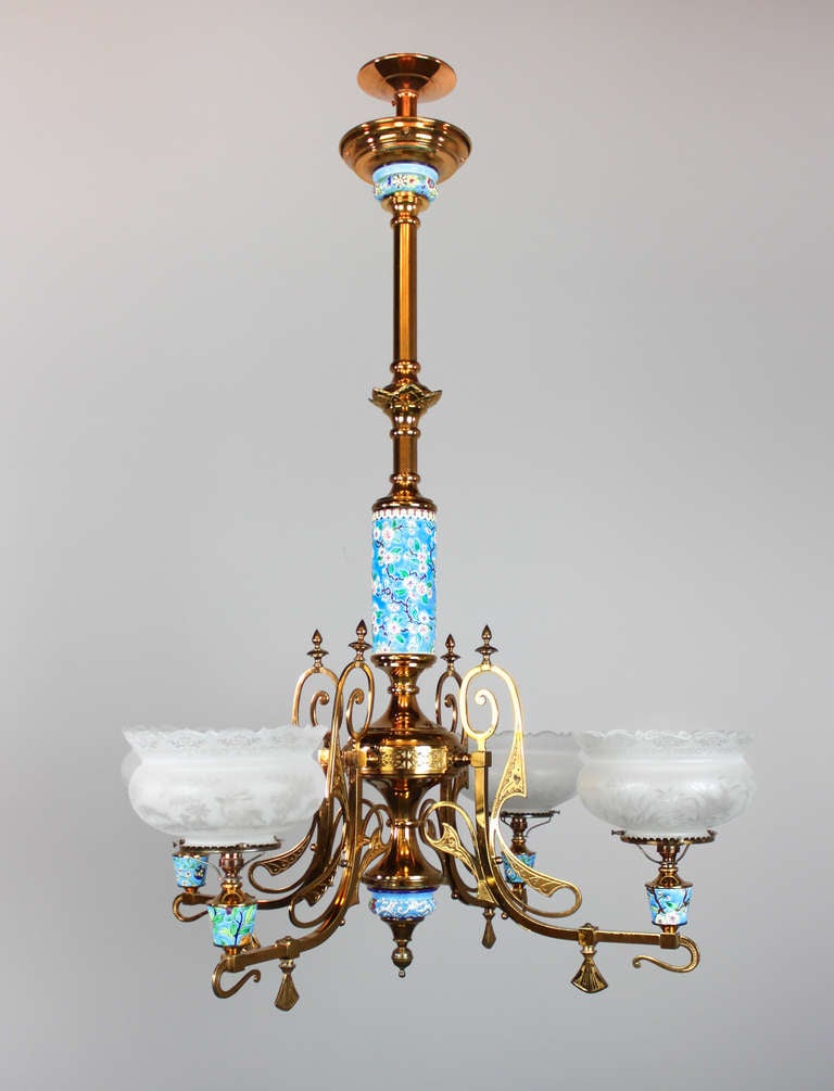 Ca. 1885 A four-light converted gas / chandelier with original, Longwy pottery inserts and scenic crown shades.

Longway pottery is named after the historic town of Longway, France. Inspired by Cloisonné and meant to appeal to the trend of