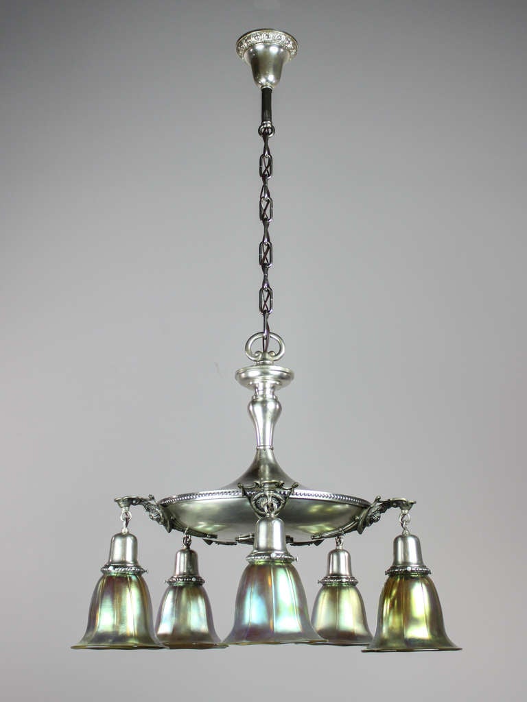Ca. 1910 Antique pan light fixture with preserved silver plated finish. A superior quality pan fixture in it's form and castings, fully decorated with matched patterns on bell holders, body and canopy. Fitted with hand-blown art glass shades,