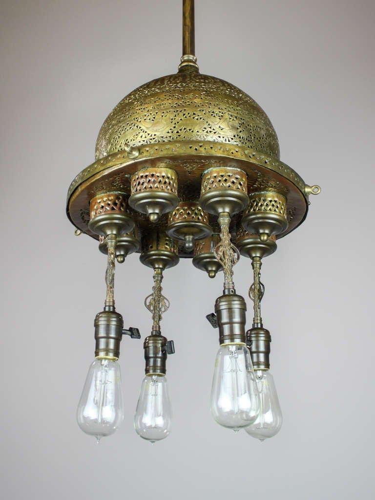 c. 1890's Islamic influenced opium den fixture, composed of American and imported components. The canopy is a 'prayer bowl' with characters of the Koran, and the body is also an import with cut-out designs of crows, deer, Egyptian characters, and