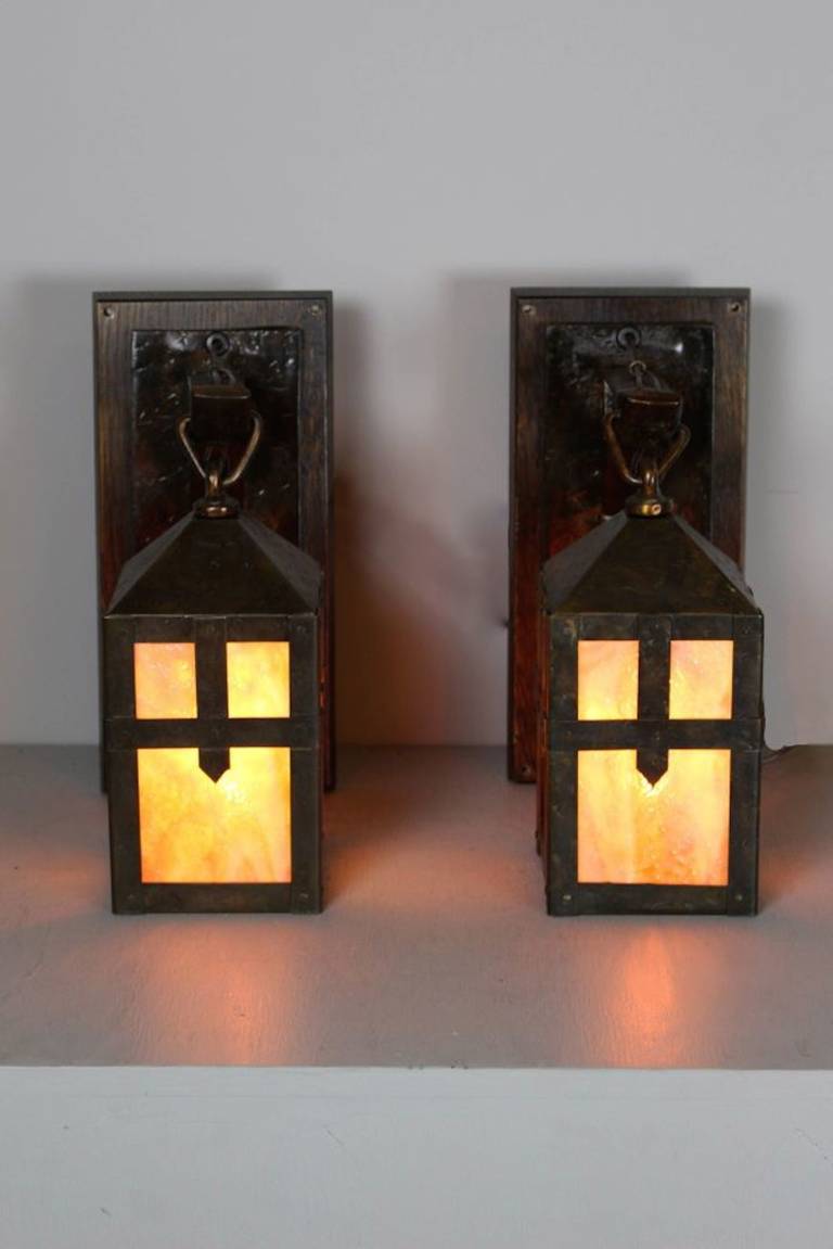 Circa 1910. Pair of Sears, Roebuck & Co. (Chicago & Philadelphia) caramel art glass monk lantern sconces.

SKU: WS1047

Measurements: 12
