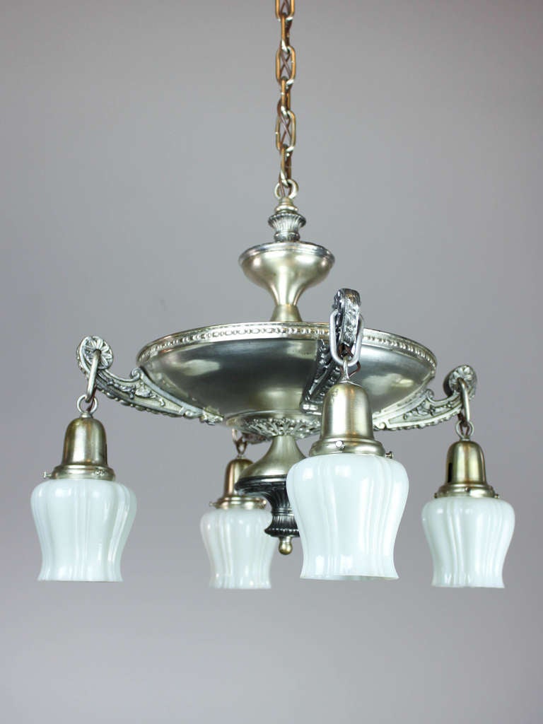 Ca. 1920 Antique pan light fixture with wonderful original silver plate and natural patina. This wide-body pan is decorated with intricate lattice work, scrolling cast arms, matching canopy and original vaseline shades. A stunning fixture with just