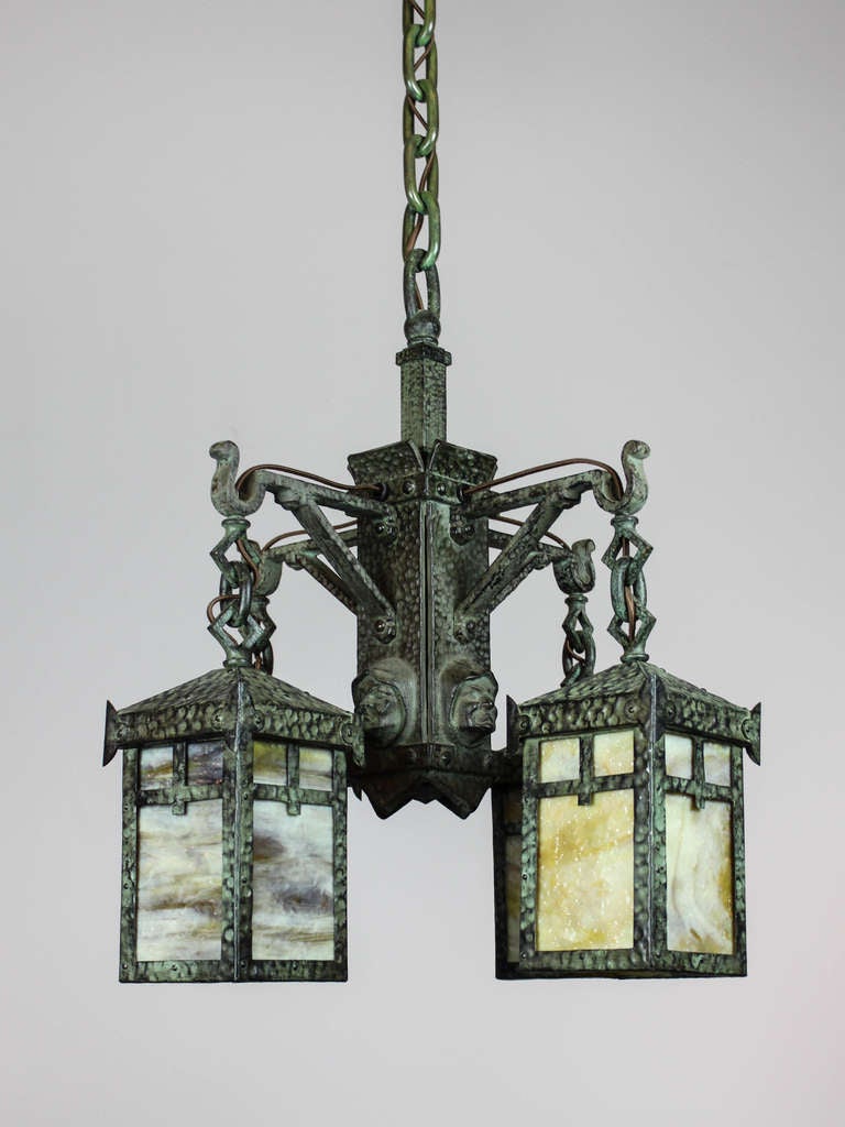 Ca. 1906 Arts & Crafts four-light ‘Monk’ fixture attributed to ‘Bradley & Hubbard’. Predominantly hand made with hammered bronze body and lantern shades. An unusual design embodied in the original ‘Verdigris’ finish and fitted with period correct