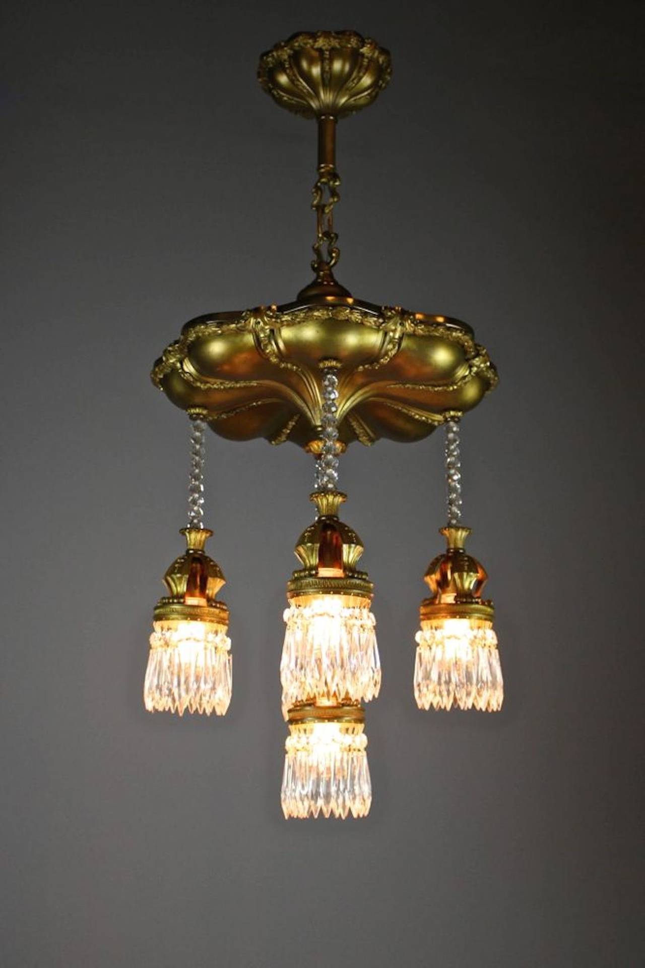 A truly gorgeous Edwardian, crystal chandelier in the Beaux-Arts style, circa 1910. Notice the rare crystal bead work with brass finish, made in Boston.
Measurements: 42