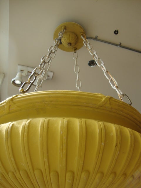 Plaster composite, hanging light from an old Vaudeville theater in Victoria, BC Canada. Rewired with six bulb configuration, chain hung with top medallion. We have three of these.
Please note that the old yellow painted surface is oxidized and