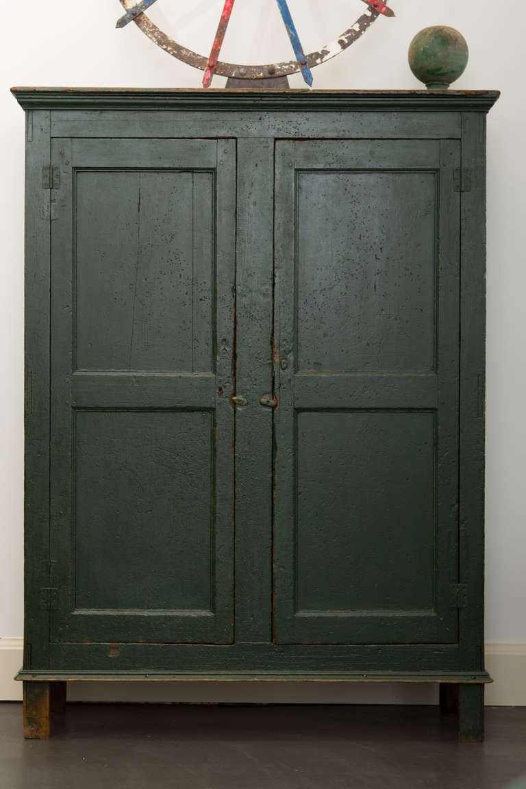 Quebec armoire recently discovered with multi panel configuration and simple post style construction.  Forged nails throughout with a nice alligatored original polychrome finish. Found in Point Claire, outside Montreal