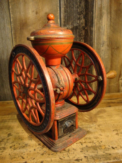 Painted, cast iron coffee grinder in untouched, working condition