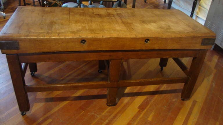 Great butcher block table. Heavy maple boards , bolted and strapped on wood base with casters.